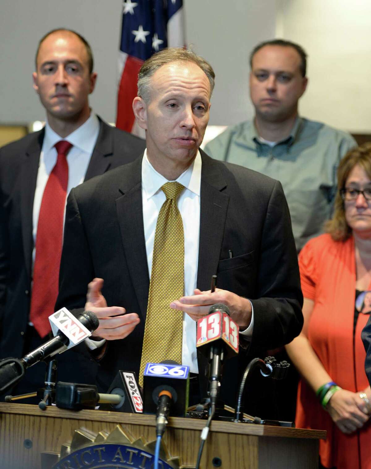 Saratoga County District Attorney James Murphy III, center, surrounded by family members of those affected by the accident in which Dennis Drue pleaded guilty on Friday Sept. 27, 2013, in Saratoga County Court in Ballston Spa, N.Y. (Skip Dickstein/Times Union)
