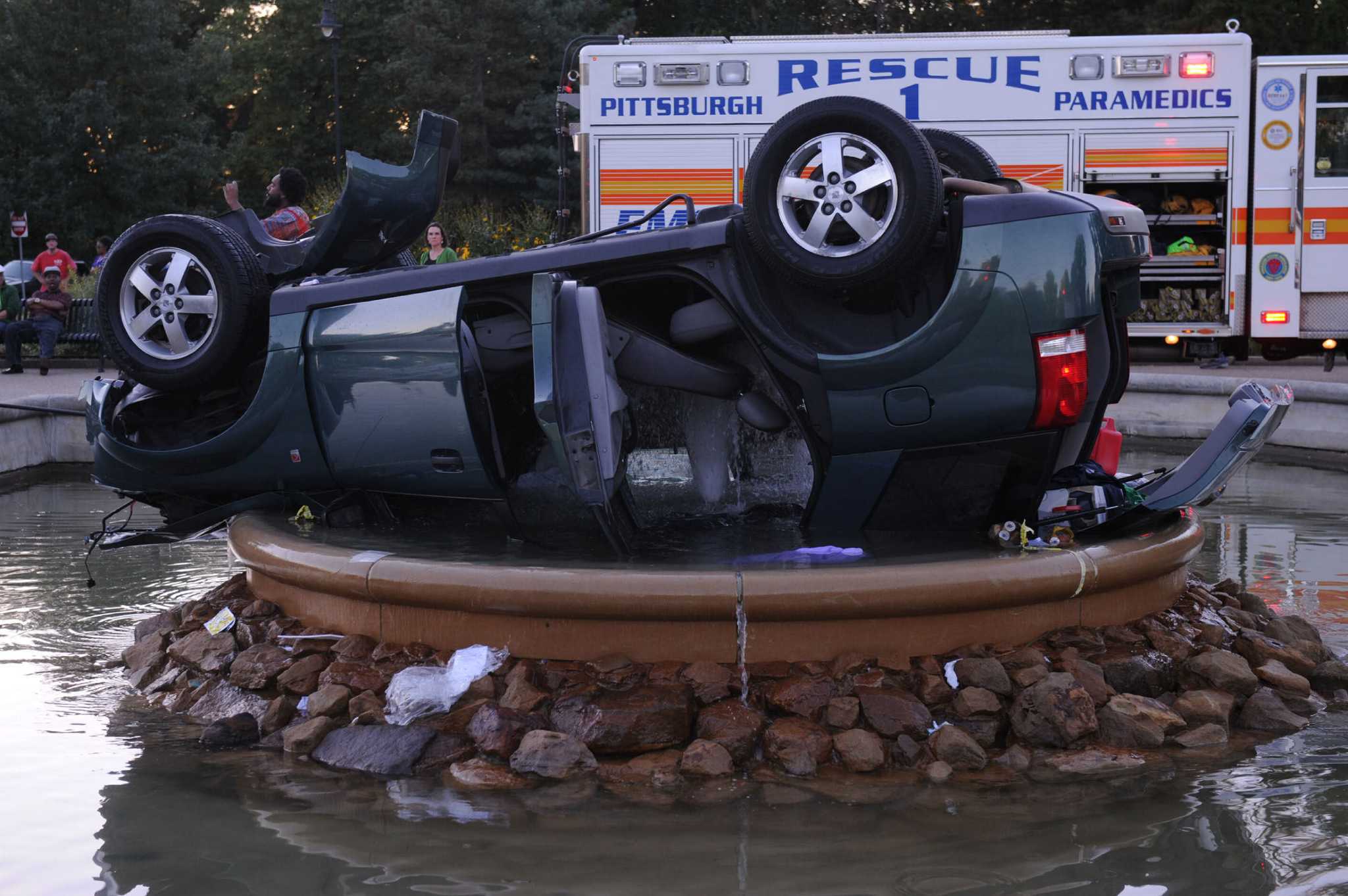 Car crashes, ends up upsidedown in Pa. fountain