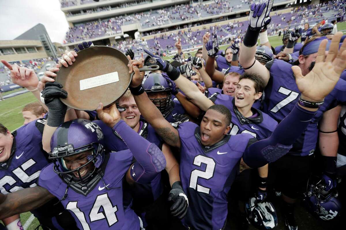 TCU quarterback Trevone Boykin (2) and his teammates celebrate with the Iron Skillet after beating SMU 48-17 in an NCAA college football game Saturday, Sept. 28, 2013, in Fort Worth, Texas.