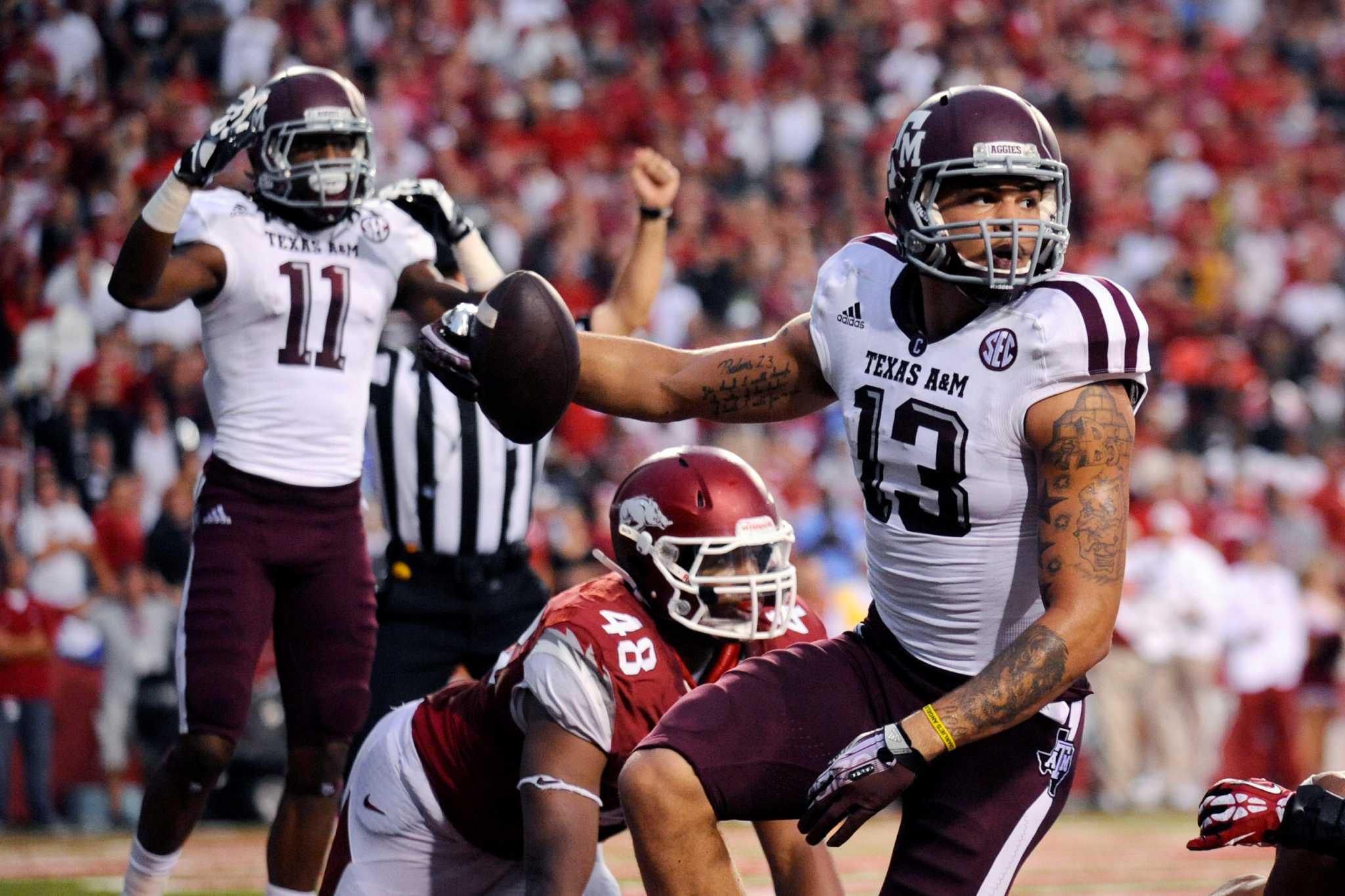 Former Texas A&M receiver Mike Evans sits during national anthem to protest  Donald Trump's win