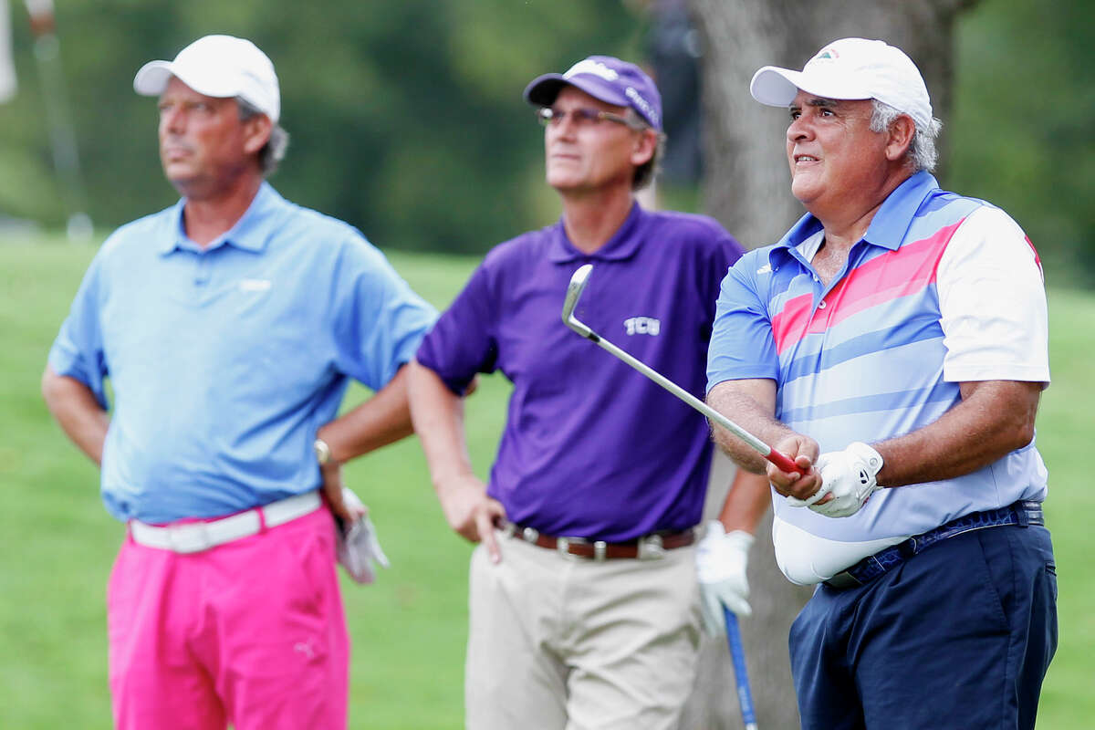 Harry Ramirez (right) follows his tee shot as Bobby Baugh (center) and Chuck Ellenwood watch on the 10th hole of the 2013 Greater San Antonio Senior Men's Championship golf tournament at Brackenridge Park Golf Course on Sunday, Sept. 29, 2013. Ramirez was tied with Baugh going into the final round but finished second to him by three strokes for the tournament.