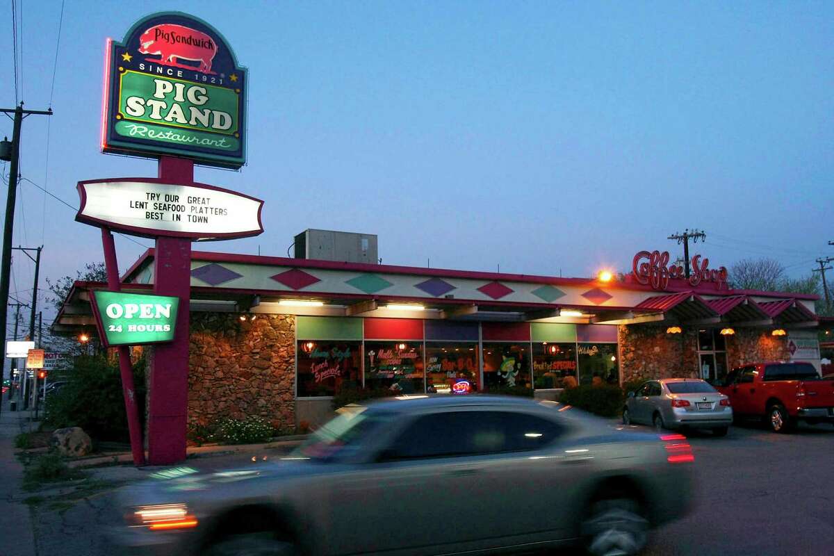A car passes the Pig Stand restaurant in San Antonio on March 21, 2008. The restaurant chain was started in 1921 and at its peak before the Great Depression, and had about 130 restaurants across the country. This is the only one remaining.