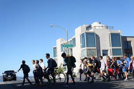 Students from the Town School for Boys middle school soccer team walk to practice in the Presidio on September 25, 2013 in the Pacific Heights area of San Francisco, Calif.