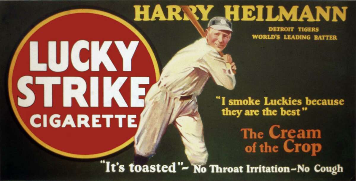 Hall of Famer Harry Heilmann is the baseball star selling Lucky Strike cigarettes on a trolley car sign, circa 1920.