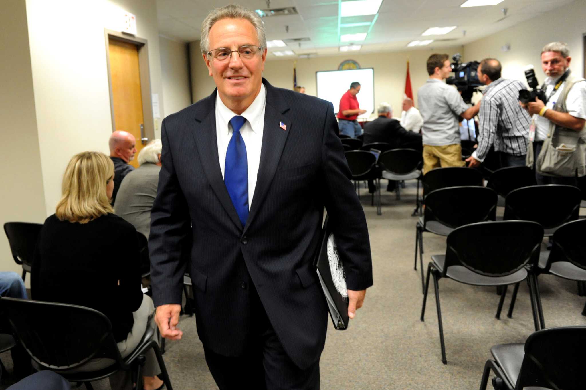 Troy taxes would rise and spending fall