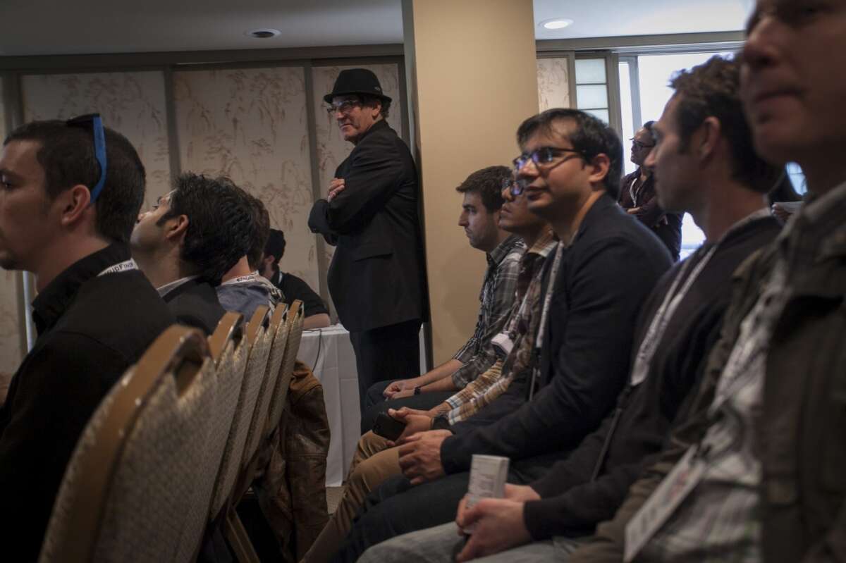Audience members during a presentation by tech freelancer Yosun Chang where she shows off a Google Glass hack that turns Google Glass into a piano or trumpet by using the optical display to virtually represent the instruments which can then be interacted with by moving your hands and head at the SF Music Tech summit in San Francisco on October 1st 2013.