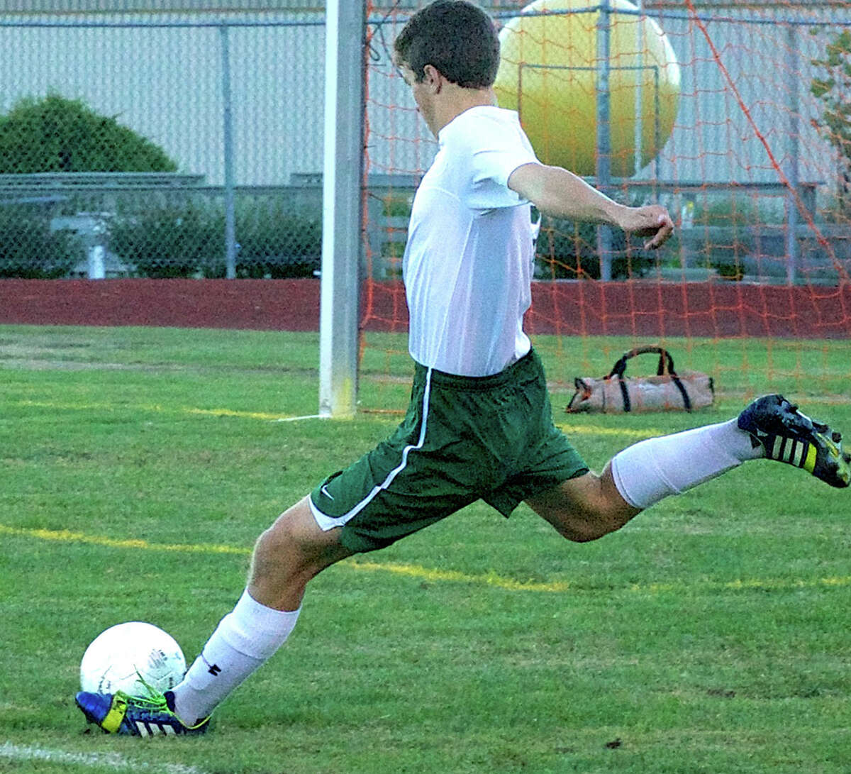 Spencer Ranno of the Green Wave clears the ball from the defensive zone during New Milford High School boys' soccer's 3-1 victory over Stratford, Sept. 23, 2013 at NMHS.