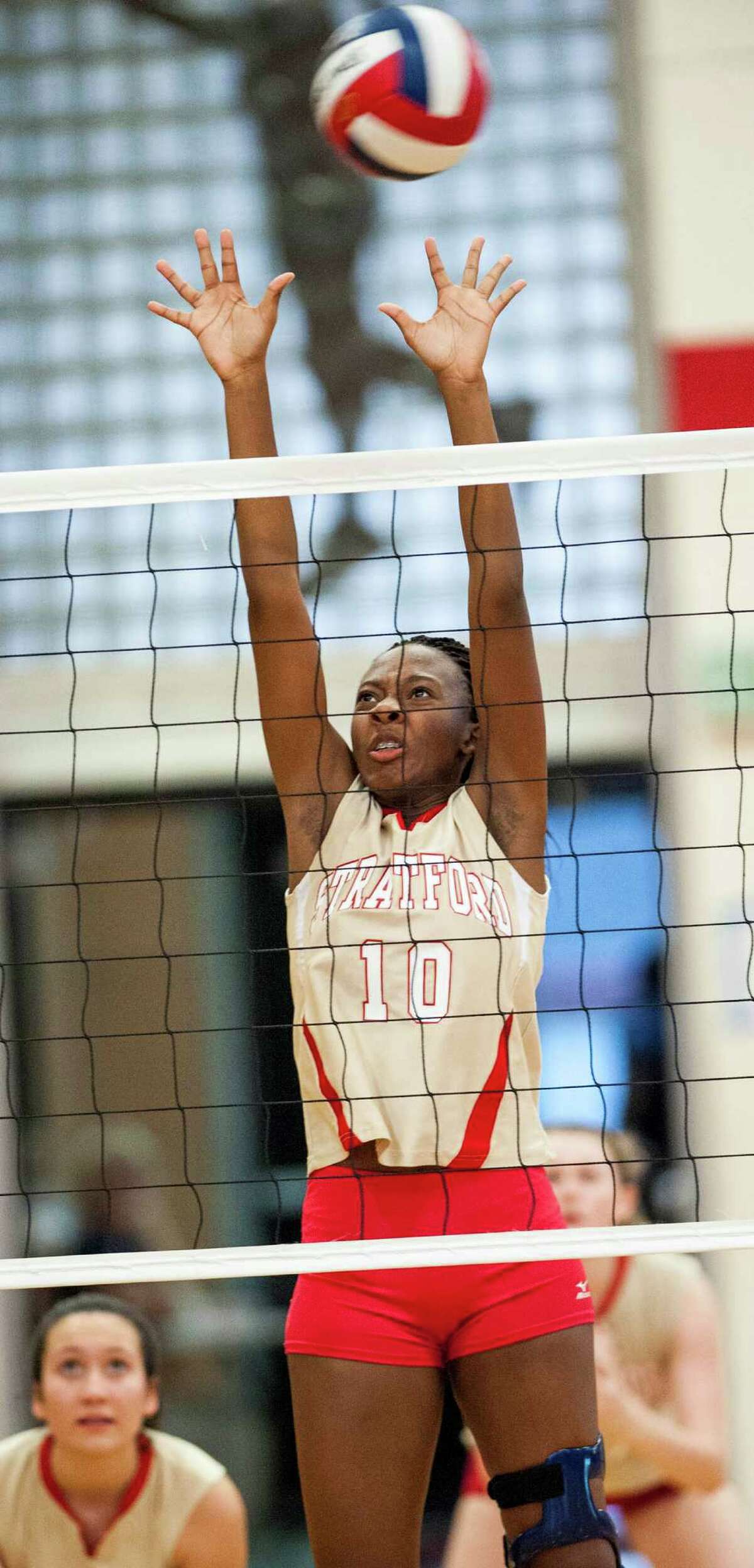 Stratford high school's Joanne Pierre-Louis goes up to try to block the ball during a girls volleyball match against Weston high school played at Stratford high school, Stratford, CT on Wednesday, October, 2nd, 2013.