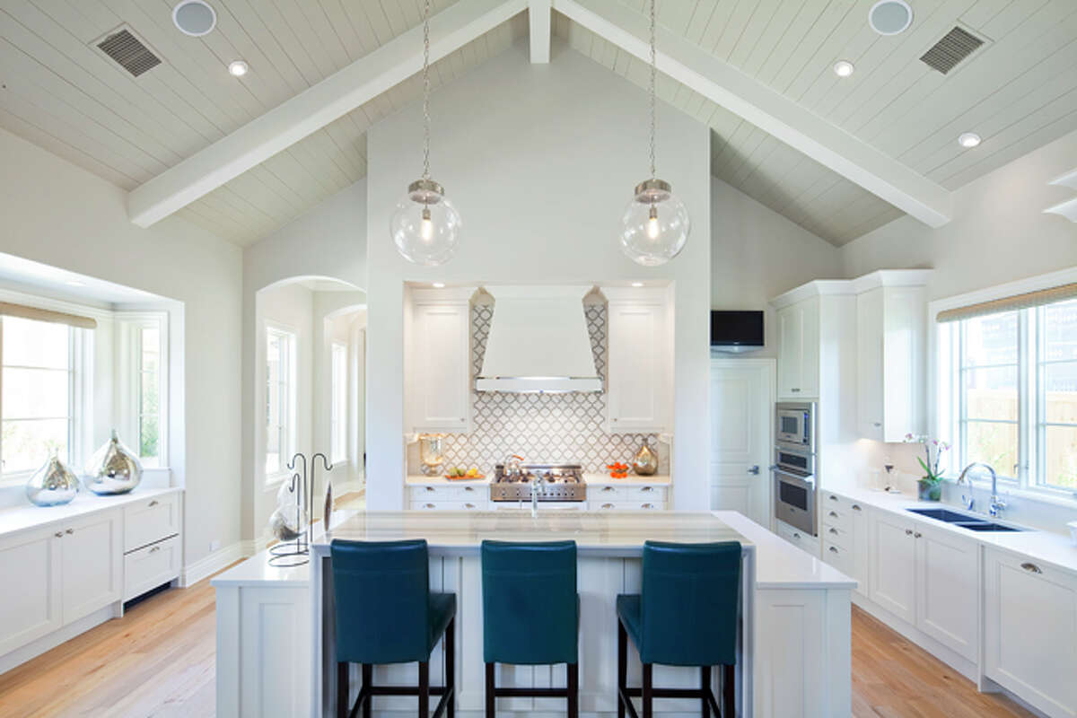 Custom-home clients are incorporating more layers of detail, such as vaulted wood ceilings and light, open kitchens with hidden storage, says builder Lisa Nichols with Nic Abbey Luxury Homes.