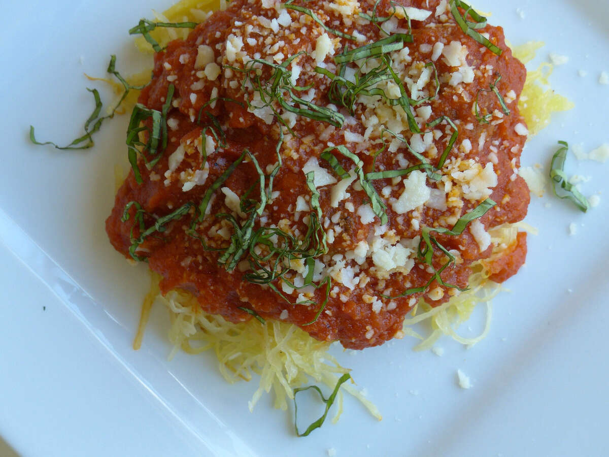 A generous sprinkling of julienned basil leaves adds freshness and extra layers of flavor to Cruzan's spaghetti squash and turkey meatballs.