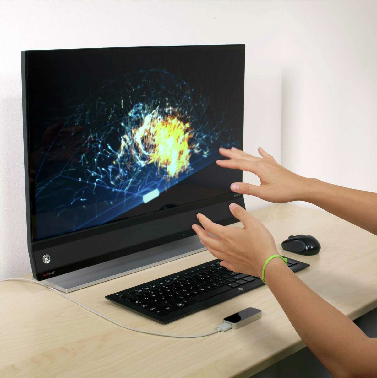 The Leap Motion Controller (pictured at the bottom of the image below the keyboard) offers 3-D motion control for Mac and PC computers using hand and finger movements.
