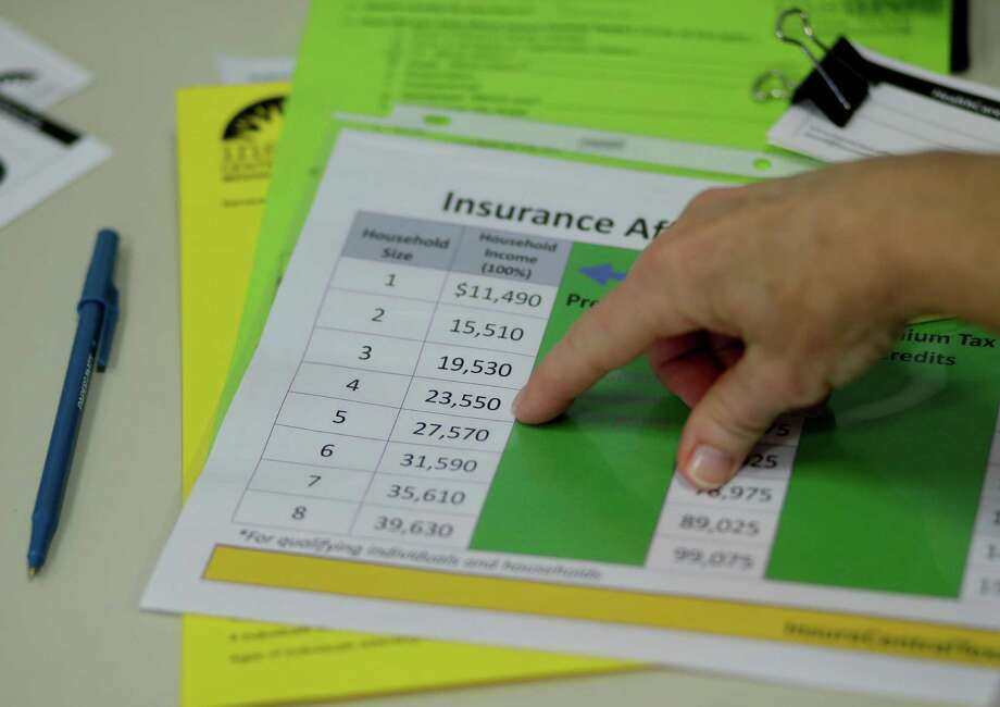 Marketplace Glitches Are Inexcusable San Antonio Express News A Volunteer Counselor With Insure Central Texas Uses Chart To Nbsp Explain Health Insurance Options