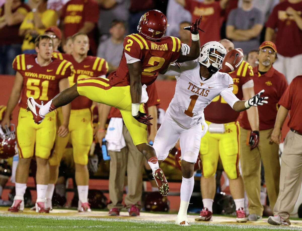 Iowa State's Jansen Watson, left, breaks up a pass intended for Texas wide receiver Mike Davis (1) during the second half of an NCAA college football game, Thursday, Oct. 3, 2013, in Ames, Iowa. Watson was called for a penalty on the play. Texas won 31-30.