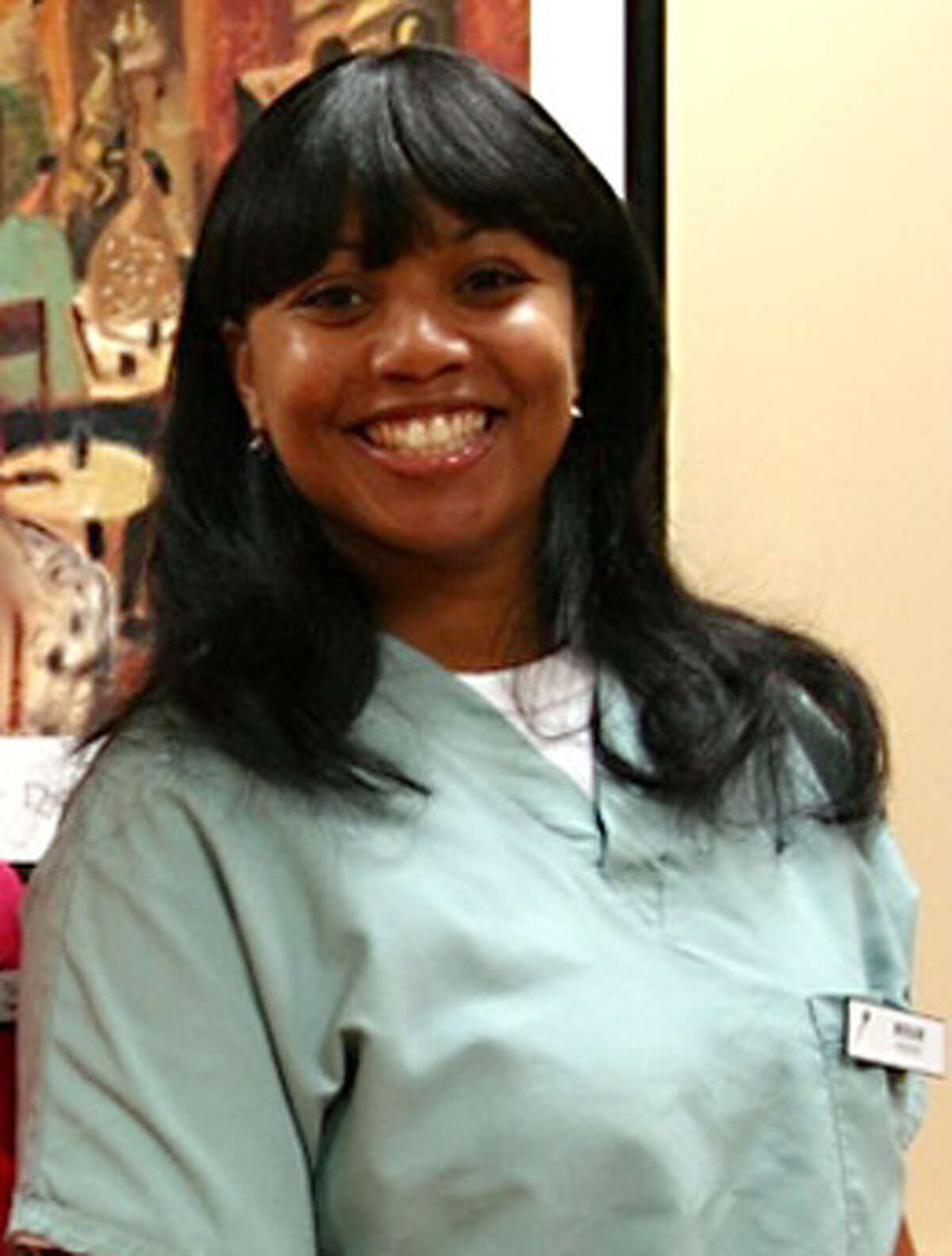 This 2011 photo provided by Dr. Barry Weiss, from the website of Advanced Periodontics in Hamden, Conn., shows former employee Miriam Carey. The 34-year-old Carey was shot to death by police after a car chase that began when she tried to breach a barrier at the White House.