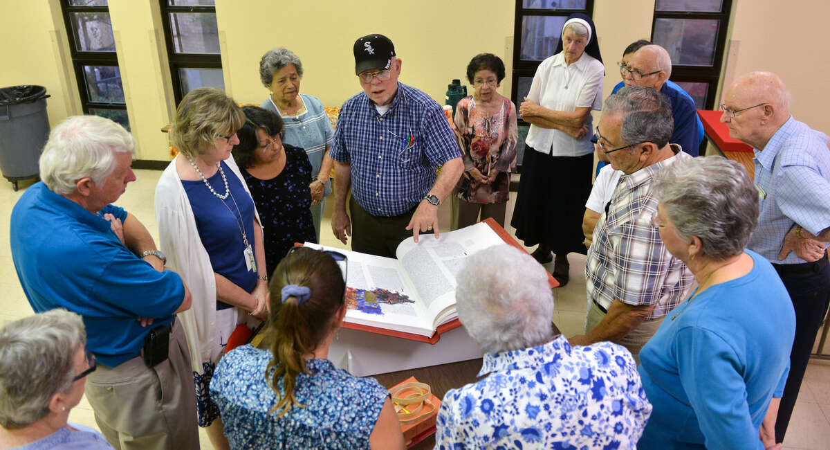 St. Mary's University theology Professor Bob O'Connor discusses the production of the St. John's Bible. The replica, one of only 299, was on display for a Bible study group at St. Gregory the Great Catholic Church.