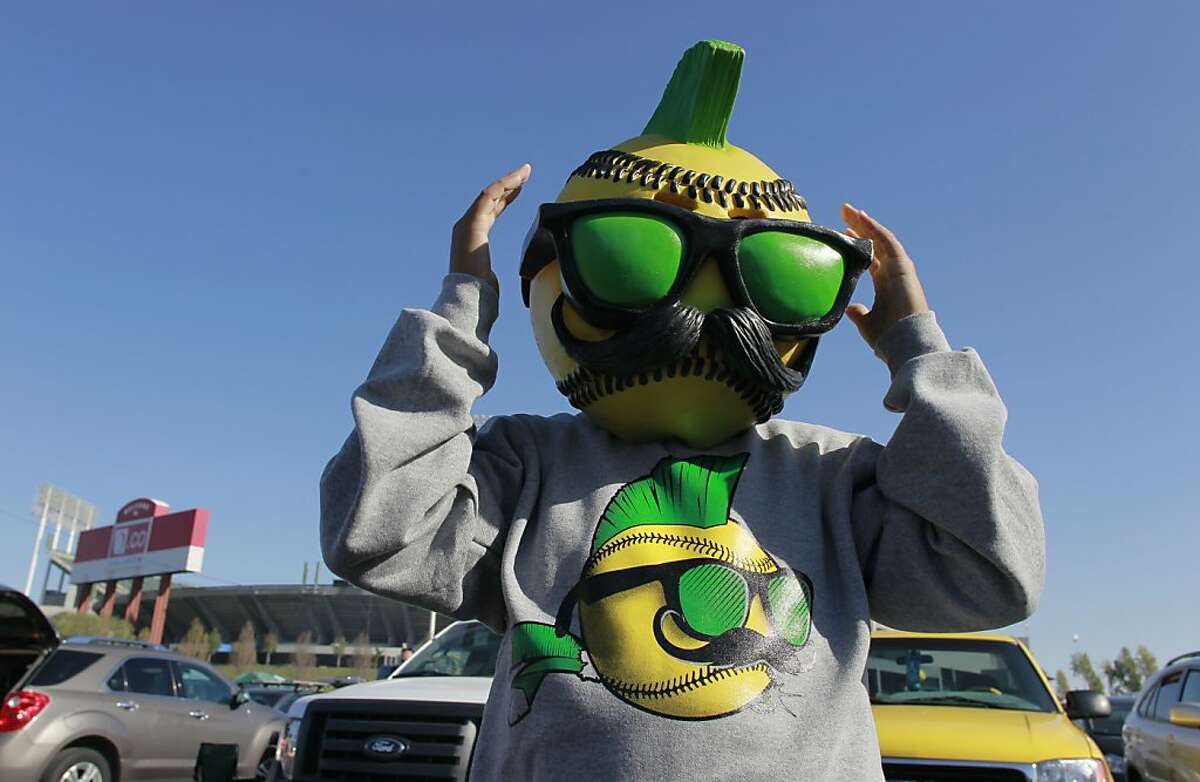 11-year-old Juju Iribarren wears a baseball mask while tailgating in the parking lot before the start of the game, on Friday Oct. 4, 2013, in Oakland, Calif. at O.co Coliseum, as the Oakland Athletics get ready to take on the Detroit Tigers in game one of the MLB American League Division Series.