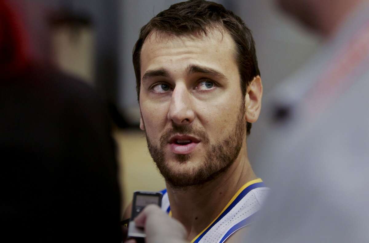 Center, Andrew Bogut, (12) talks with reporters as the Golden State Warriors hold a media day at their practice facility in downtown Oakland, Calif. on Friday September 27, 2013.