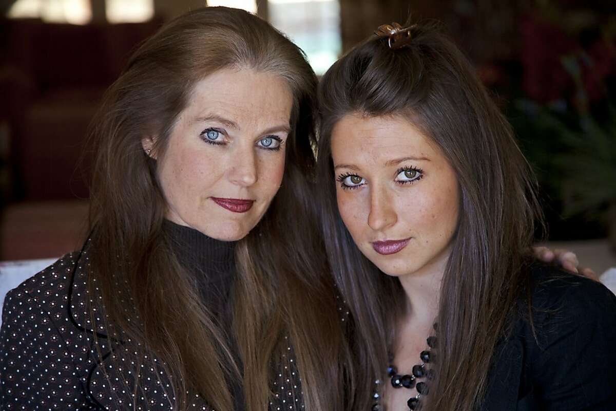 Charlotte Laws (left) and her daughter Kayla at their Woodland Hills home. Charlotte successfully fought to have her 26-year-old daughter Kayla's topless photo taken down from a website that featured images of women and men who unwillingly had private nude photos become public.