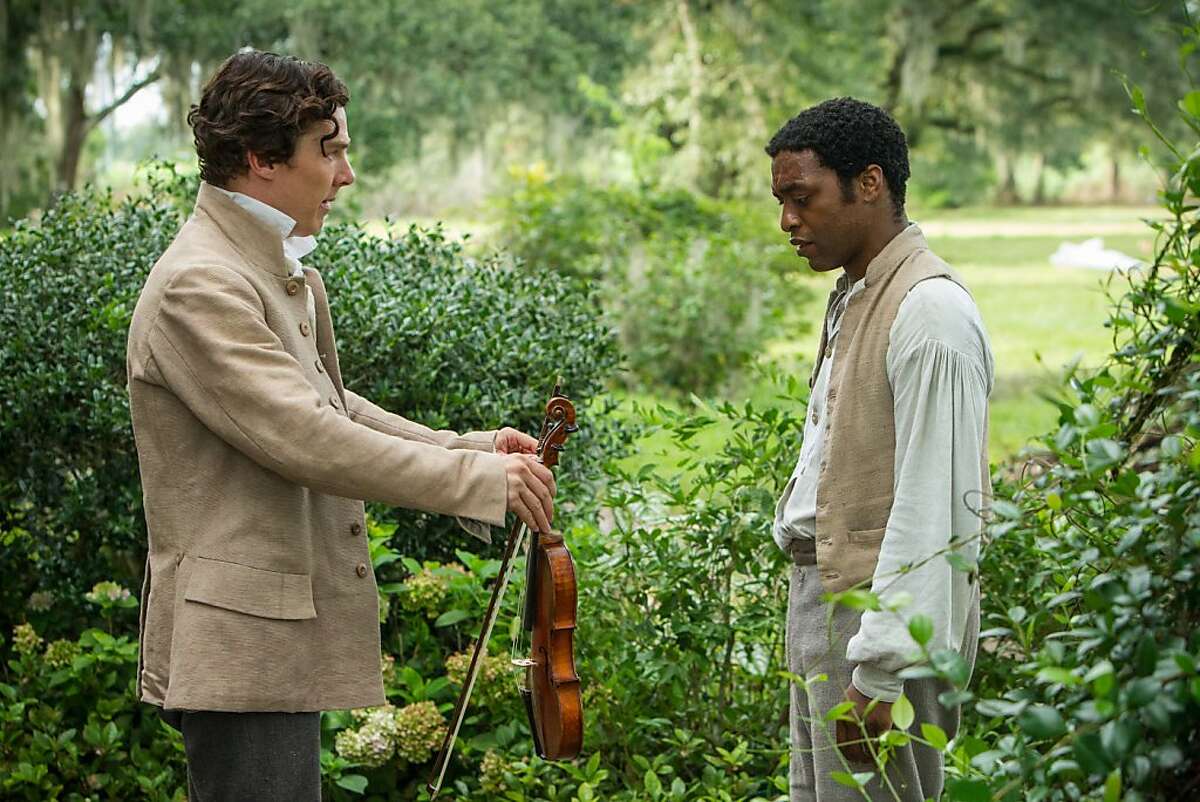 This film publicity image released by Fox Searchlight shows Benedict Cumberbatch, left, and Chiwetel Ejiofor in a scene from "12 Years A Slave." The film, by director Steve McQueen, is being hailed a masterpiece and a certain Oscar heavyweight. (AP Photo/Fox Searchlight Films, Jaap Buitendijk)
