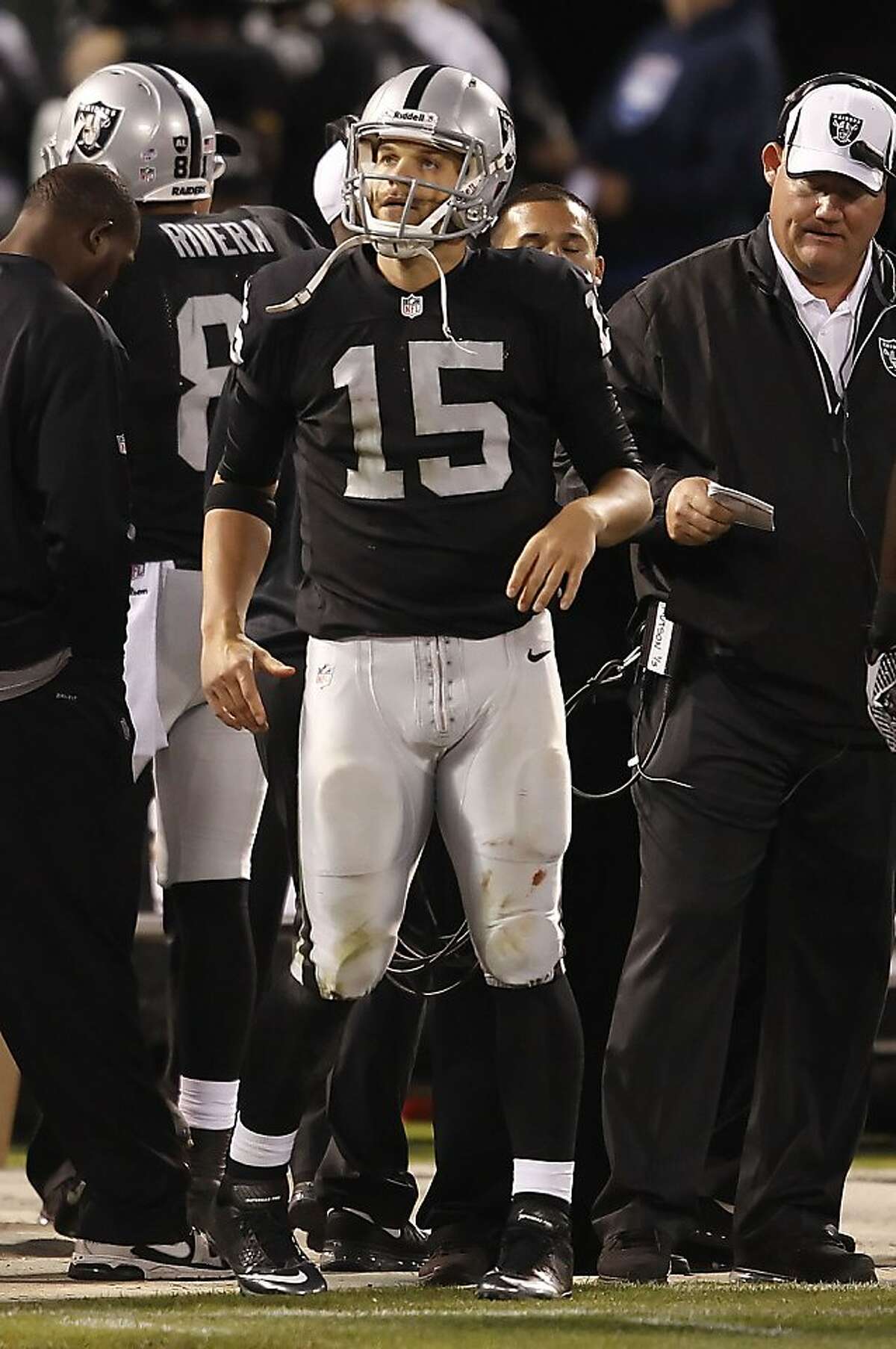 Raiders' quarterback Matt Flynn, (15) sat out the second half, as the Oakland Raiders take on the Chicago Bears in a pre-season game at the O.co Coliseum in Oakland, Calif. on Friday August 32, 2013.