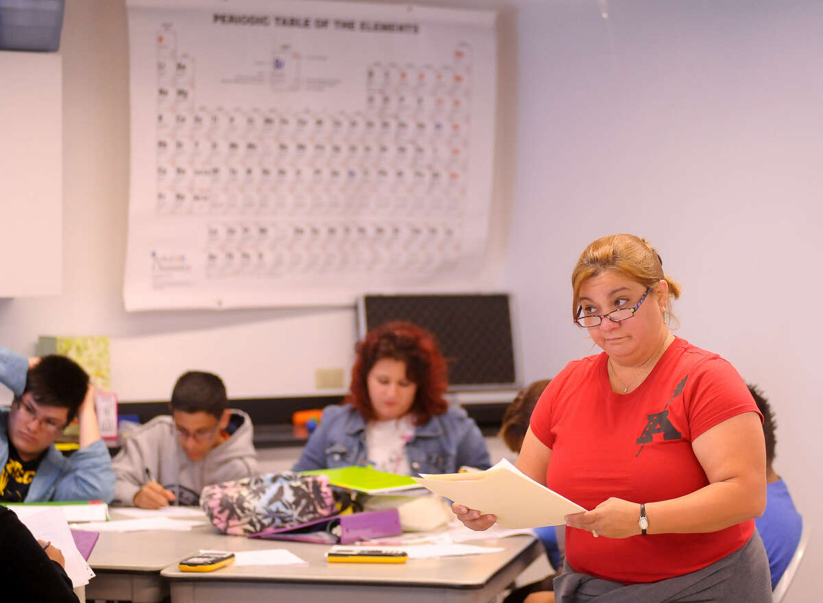 Lisa Villarreal teaches physics for juniors and seniors at the academy. The tuition-free college-prep school has a 10-year lease with the nonprofit Alameda Theater Inc.