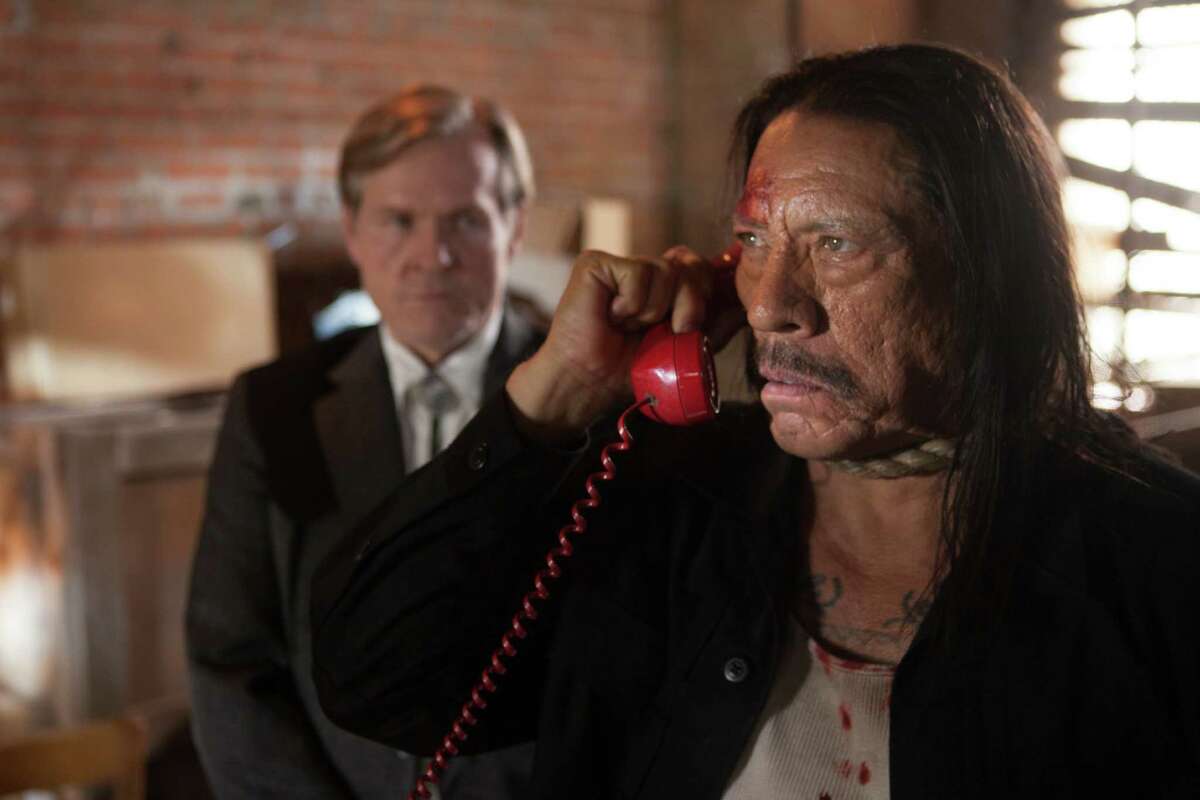 William Sadler (left) as Sheriff Doakes and Danny Trejo as Machete in “Machete Kills.”