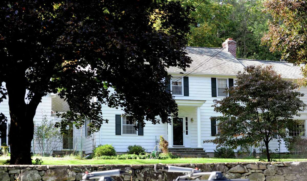 Investigators and police remained at the home of Joseph C. Callahan, 625 Bronson Road in Fairfield, Conn. on the morning of Thursday, Oct. 3, 2013.