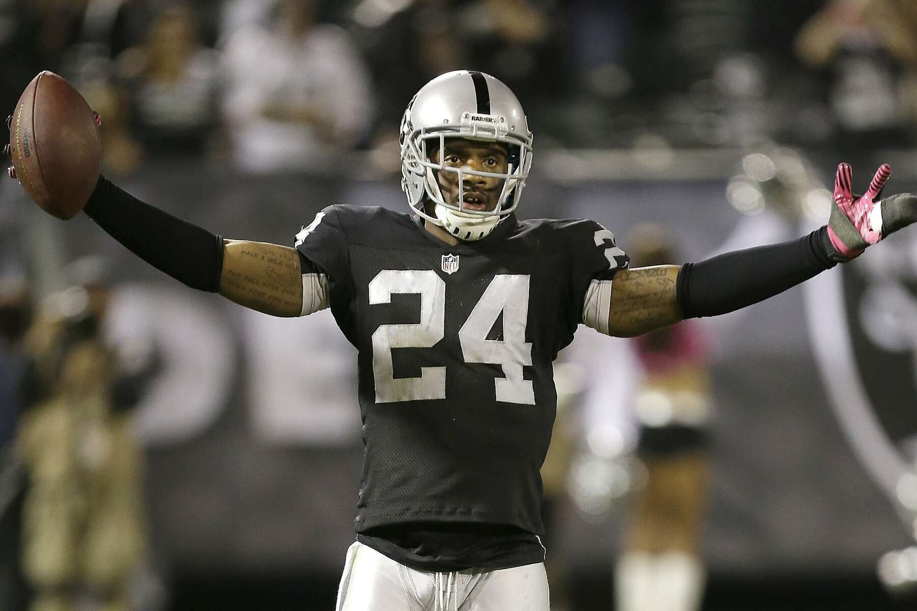 Charles Woodson celebrates an interception and a brief moment of