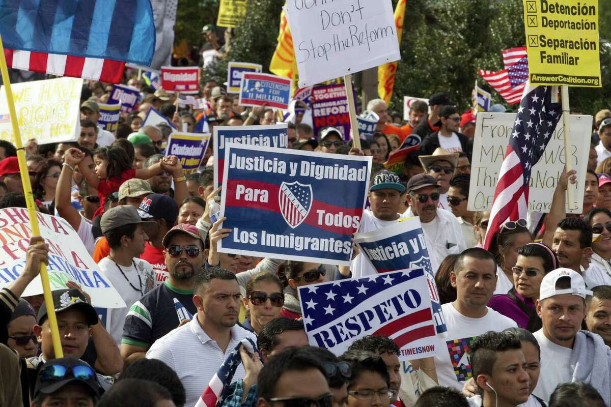 Demonstrators march toward Capitol Hill in Washington on Tuesday as they demand the House Republican leadership pass comprehensive immigration reform with a path to citizenship.