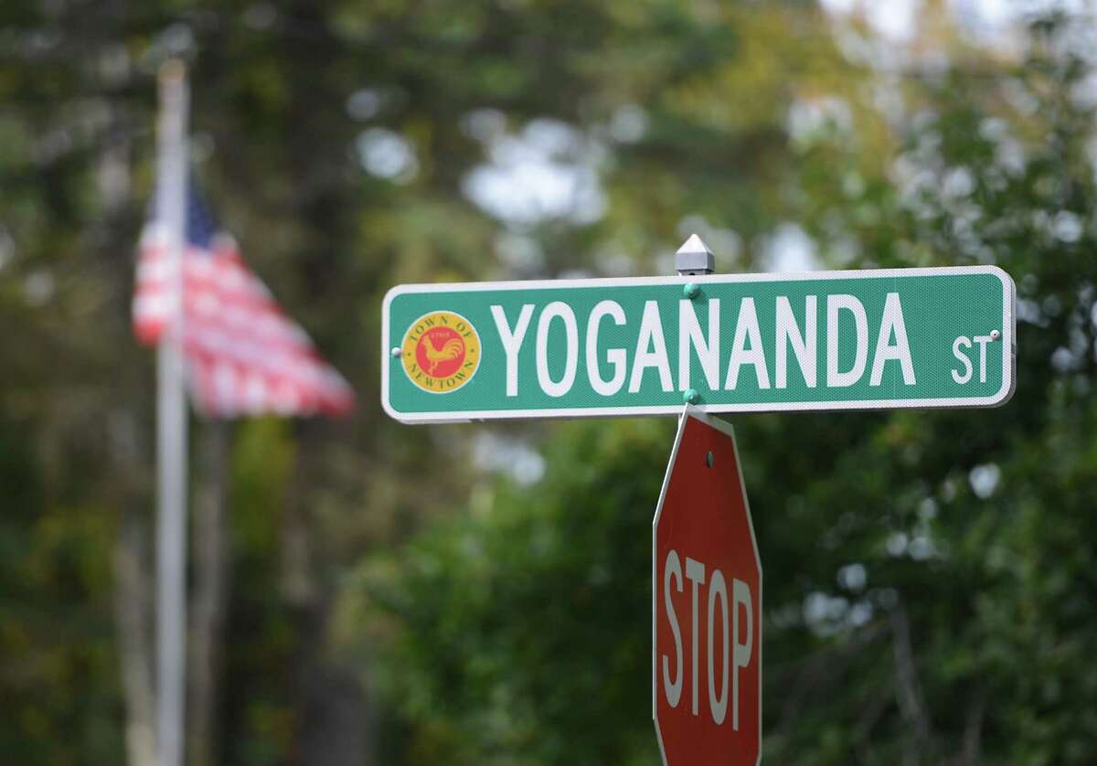 The Yogananda Street sign, near the home of the Sandy Hook Elementary School shooter, in Newtown, Conn. on Wednesday, Oct. 9, 2013. Ten months after the tragedy, the Yogananda Street neighborhood continues the healing process despite the proximity to the vacant home.