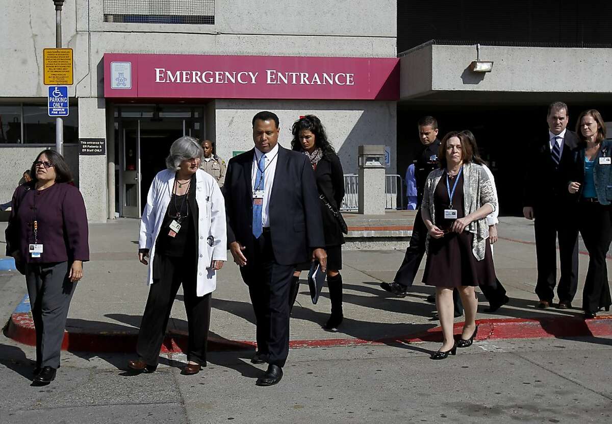 Hospital officials walked to the press conference in the parking lot but had would not speak to the press Wednesday October 9, 2013 in San Francisco, Calif. Officials at San Francisco General Hospital confirmed the identity of the woman found in an emergency exit as as missing patient Lynne Spalding.
