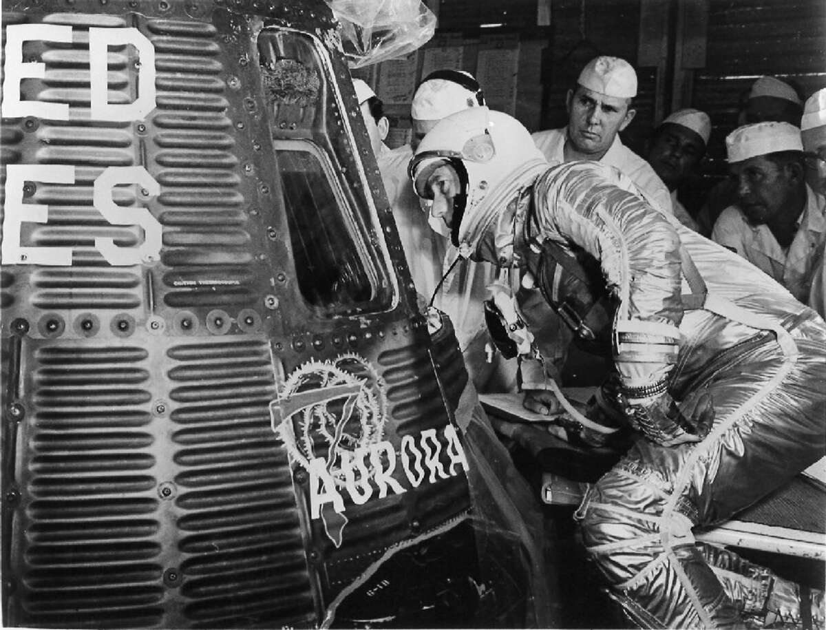 Scott Carpenter looks into Aurora 7. He was one of the original seven astronauts selected for NASA's Project Mercury in 1959. It was the first human spaceflight program of the United States.