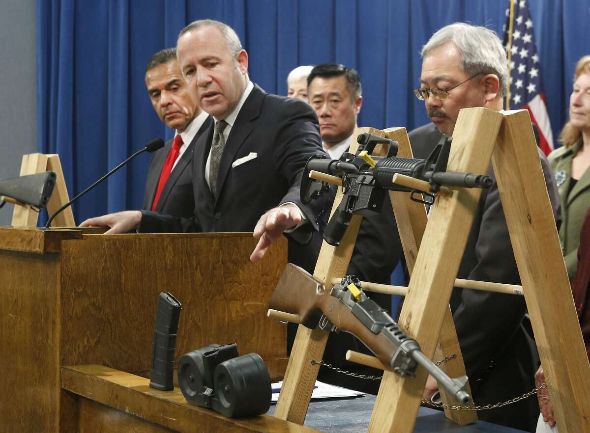 In this Feb. 7, 2013 file photo, Senate President Pro Tem Darrell Steinberg, second from left, gestures to a pair of semi-automatic rifles as he discusses a package of proposed gun control legislation at a Capitol news conference in Sacramento, Calif. Gov. Jerry Brown vetoed Steinbergs's SB374 which would have banned future sales of most semi-automatic rifles that accept detachable magazines, Friday, Oct. 11, 2013.(AP Photo/Rich Pedroncelli,File)