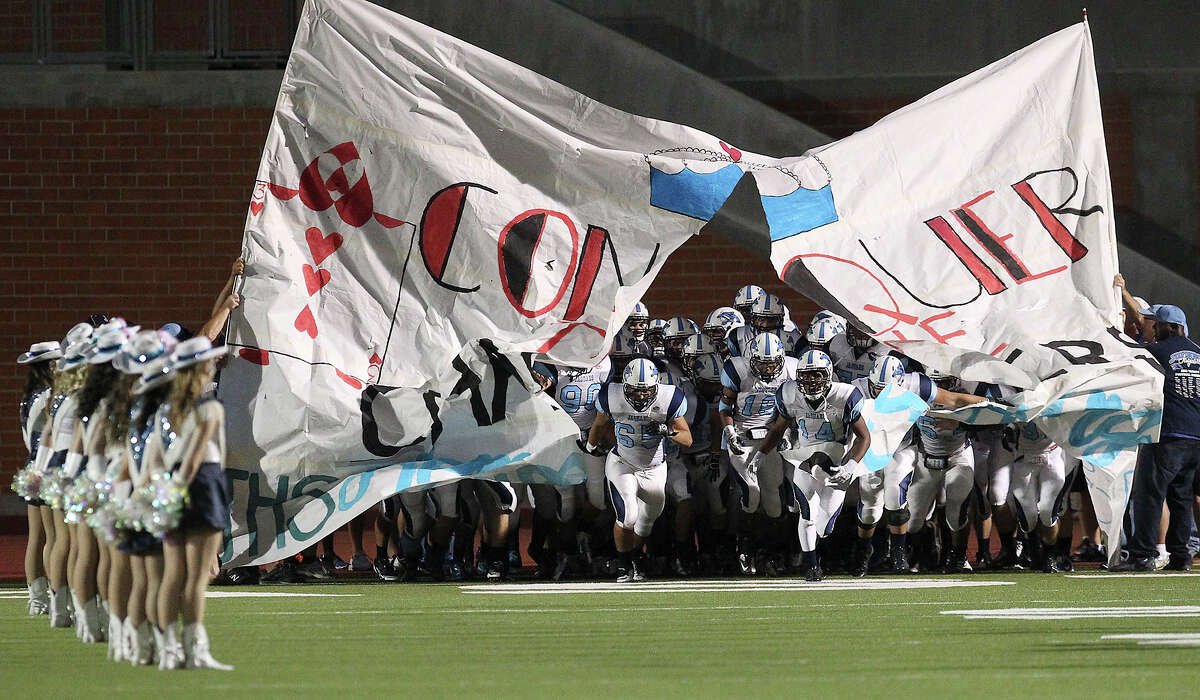 The Johnson Jaguars take the field for their game against the Churchill Chargers at Heroes Stadium on Friday, Oct. 11, 2013.