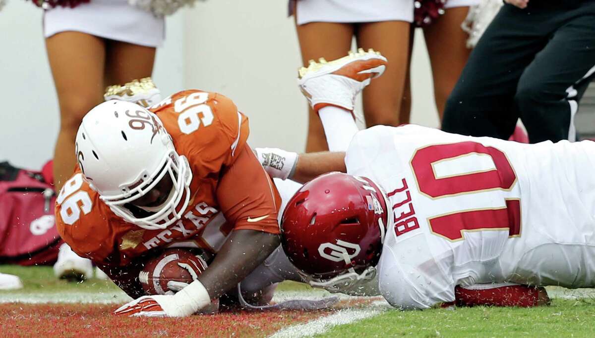 The lowlight of a dismal day for Oklahoma quarterback Blake Bell comes when Texas' Chris Whaley gets past Bell on a 31-yard interception return for a touchdown. Bell's rushing stats: seven carries for minus-27 yards.