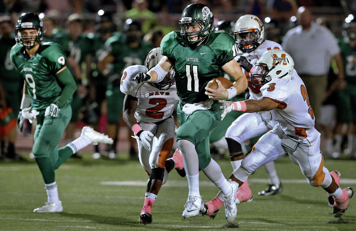 Ty Summers takes off on a touchdown run for the Rattlers as Madison plays Reagan at Heroes Stadium on October 12, 2013.