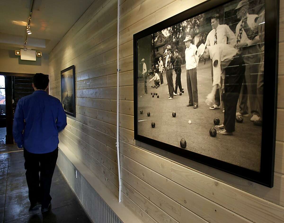 A large picture in the hallway between the outdoor area and the front has a picture of bocce ball playing Thursday October 10, 2013 in San Francisco, Calif. Rustica restaurant near 24th and Mission is trying to get approval for putting bocce ball courts in an area behind the restaurant.