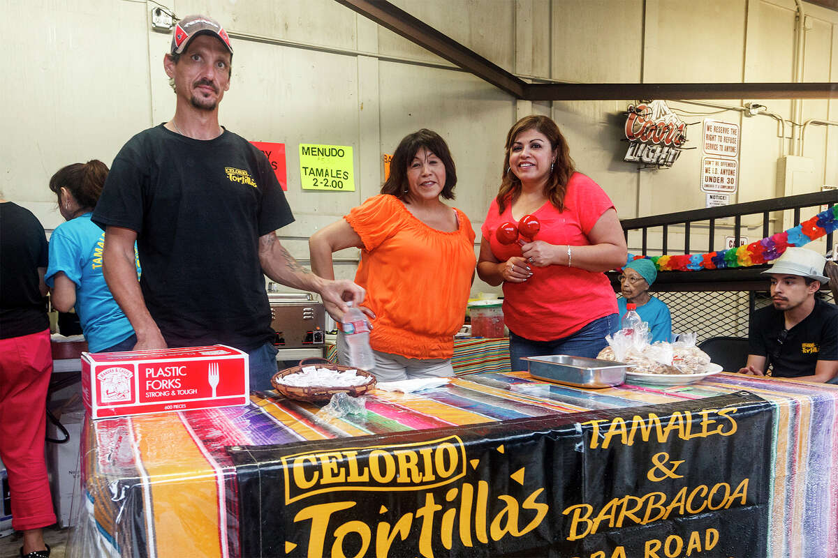 Walter Stevens (from left), Anno Porto and Diana Valague man the Celorio Tortillas booth at the Barbacoa & Big Red Fall Festival 2013 at the R & J Music Pavilion, 18086 Pleasanton Rd, on Sunday, Oct. 13, 2013. MARVIN PFEIFFER/ mpfeiffer@express-news.net