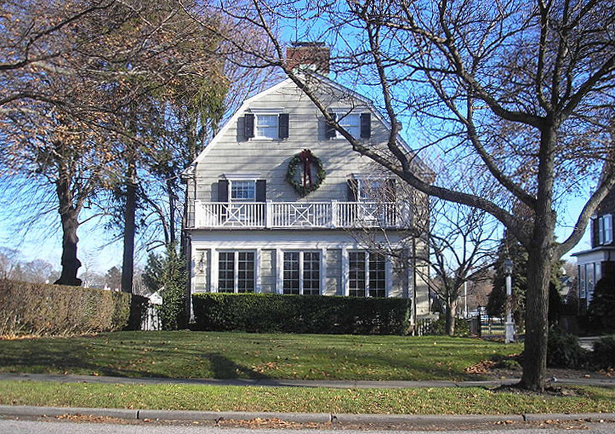 Amityville House, real life scene of gruesome murder in which Ronald De Feo massacred 6 of his family members. Later, the Lutz family moved in, and then moved out, chased, they claimed, by unwelcoming paranormal activity exhorting them (famously) to "Get Out!"