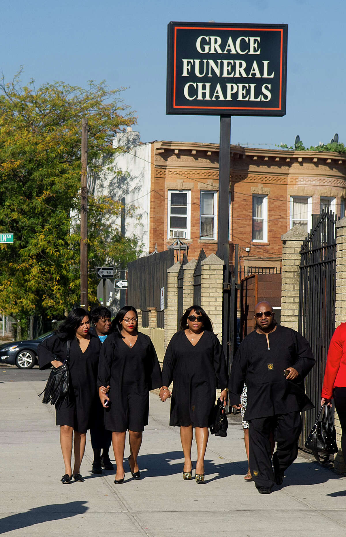 Mourners, including Miriam Carey's sister, Valarie Carey, second from right, enter Grace Funeral Chapels in Brooklyn, N.Y., on Tuesday, October 15, 2013, where the funeral for Miriam Carey was held.