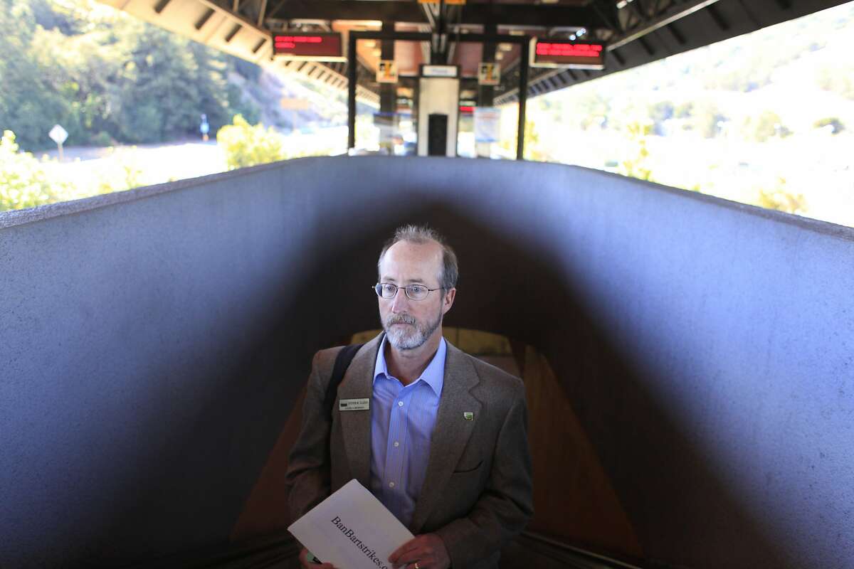 Riding the escalator to the Orinda station platform, Orinda City Council member and banBARTstrikes.com organizer Steve Glazer prepares to start his campaign to ban transit strikes in California by riding to all 44 BART stops on Monday, October 14, 2013 in Monday Oct. 14, 2013 in Orinda, Calif.