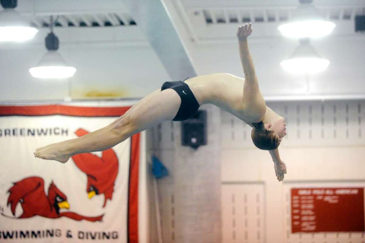 Ridgefield diver Eric Peterson in action as Greenwich High hosts Ridgefield High in a boys swim meet Wednesday afternoon, January 27, 2010.