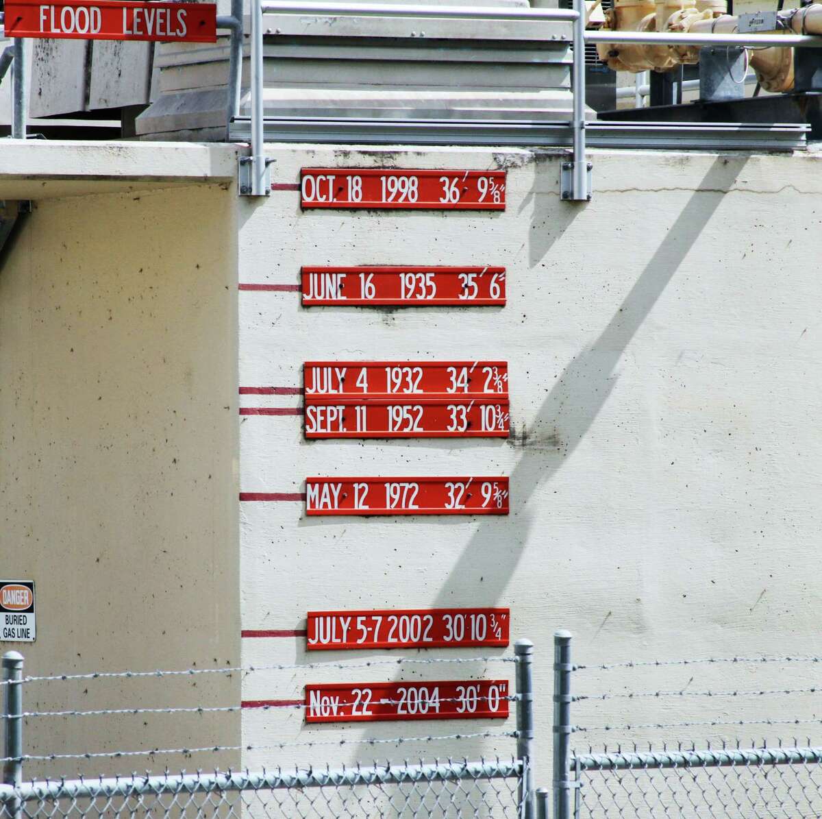 Major flood crests marked on the Seguin water treatment plant on the Guadalupe River show the record level of the 1998 flood.