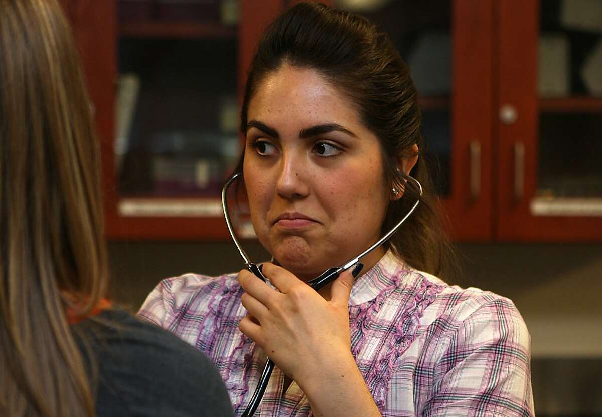 Sports Medicine student Pricilla Perez, 23 years old, takes heart readings during a human physiology course at Solano Community College in Vacaville, California, on Wednesday, October 16, 2013. Solano College is participating in a new pilot program that will offer classes such as this during summer at a higher cost.