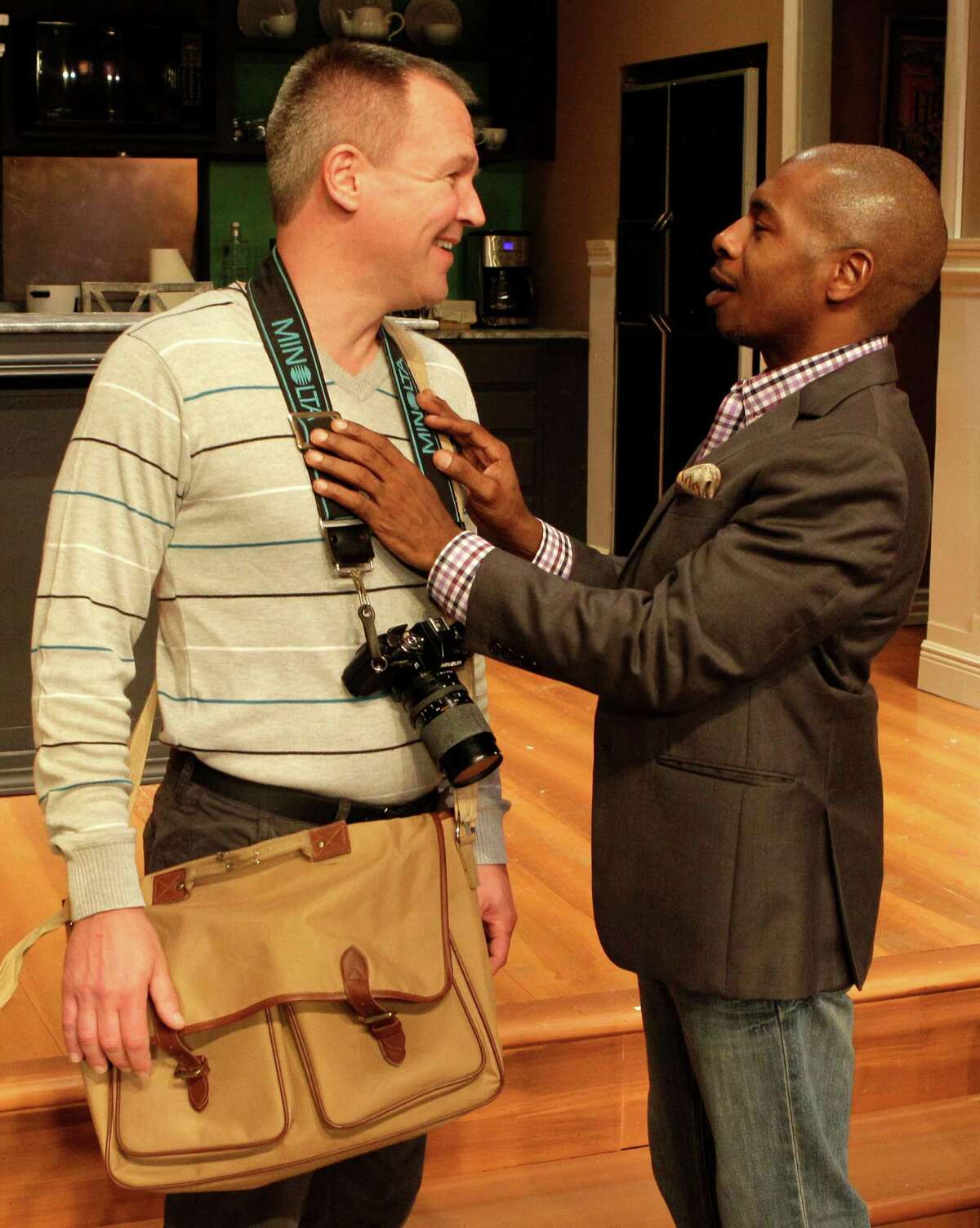 Steve Bullitt, left, and Adrian Porter perform in the Ensemble Theatre's production of "Immediate Family."