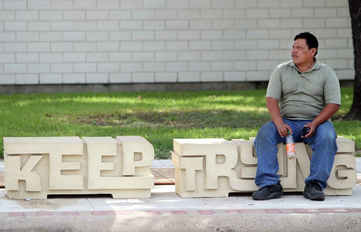 Evaluation of Houston's new bus service shows that demand and supply are more balanced, though gaps still exist. In this photo: Jose Escobar sits at the bus stop near the Navigation Boulevard Esplanade.