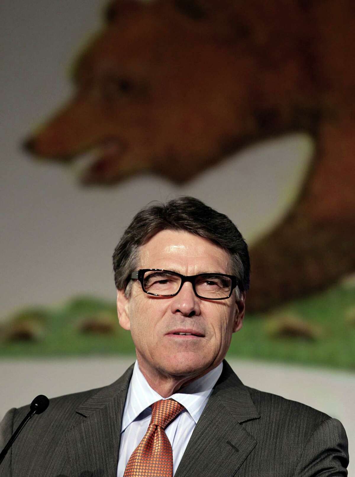 Texas Gov. Rick Perry gives the keynote speech at the California Republican Party convention in Anaheim, Calif., Saturday, Oct. 5, 2013. (AP Photo/Reed Saxon)