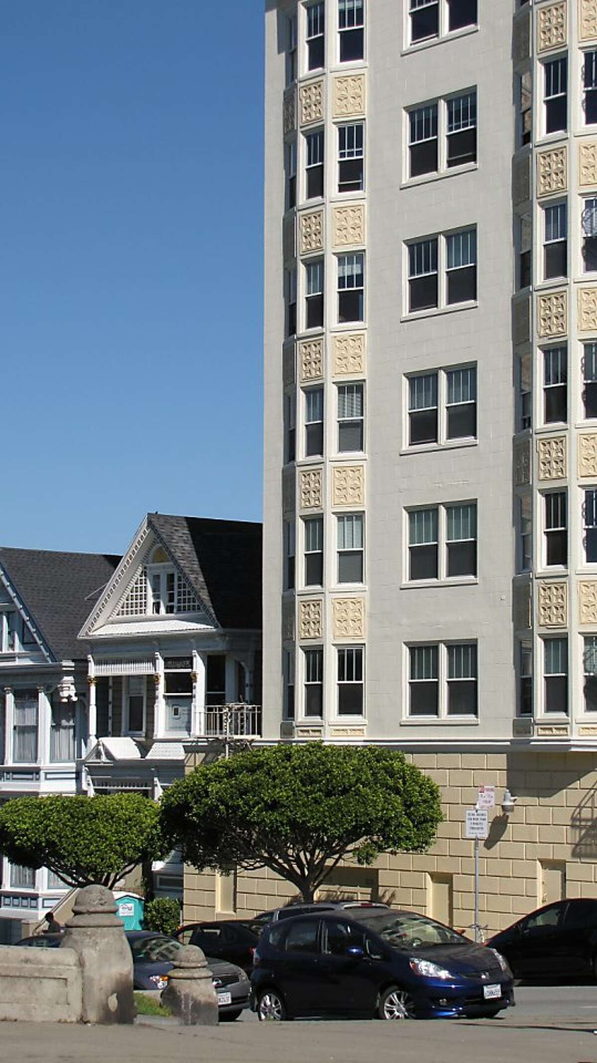 The 6-story apartment building at 700 Steiner St. opened in 1927 and was designed by Philip Harris. It stands next to the "painted ladies" of Alamo Square but is rarely photographed, despite its urbane strength.