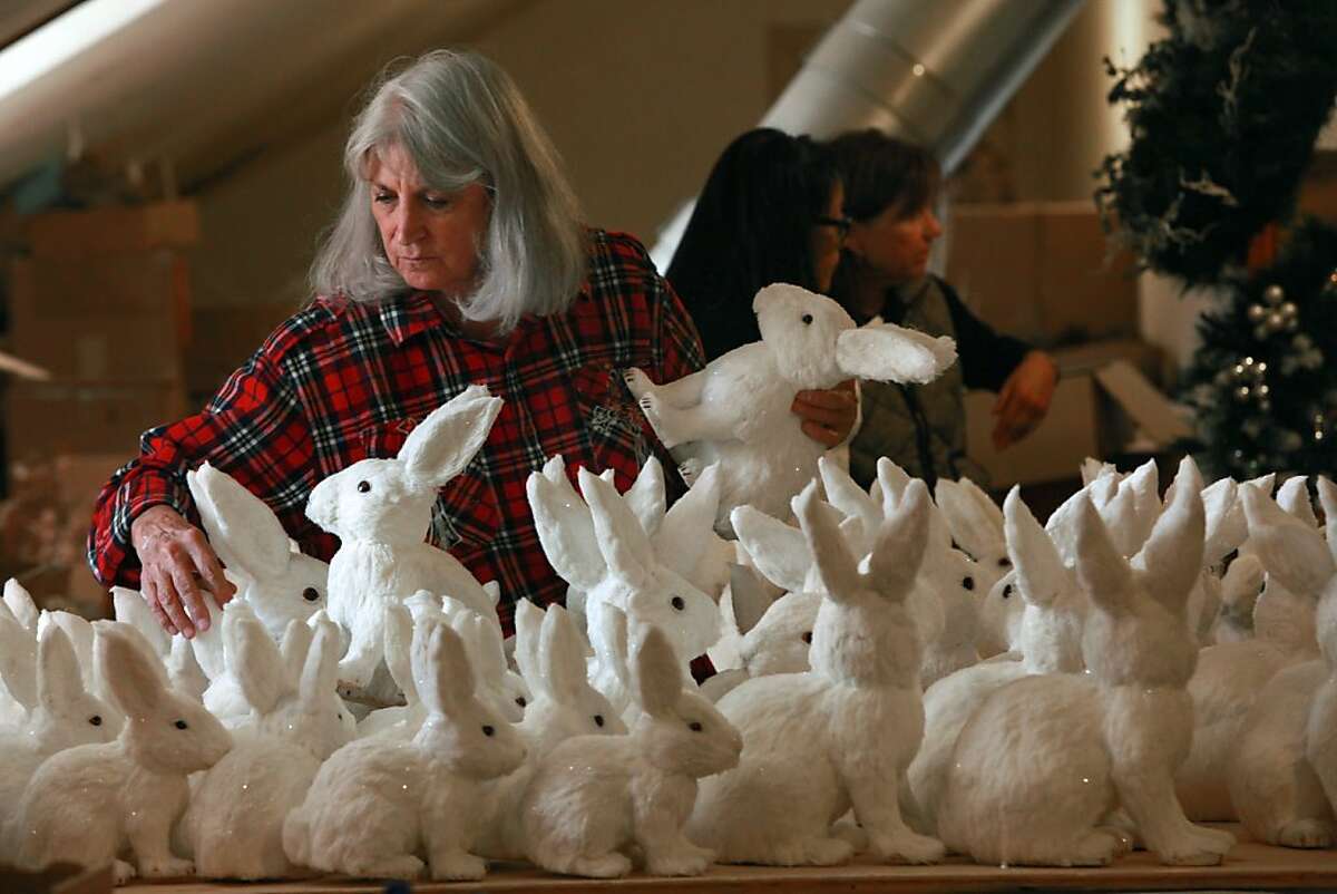 Filoli employee Terry Dwight sorts snow bunnies from Kaemingk at the Filoli mansion in Woodside, California, on Thursday, October 10, 2013. 'Ice Fantasy' is the theme for this year's Christmas Holiday event.