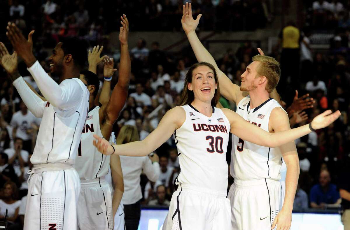 Connecticut's Breanna Stewart (30) rallies the audience with her inter-squad team during the at the men's and women's basketball teams' First Night event in Friday, Oct. 18, 2013, in Storrs, Conn. (AP Photo/Jessica Hill)